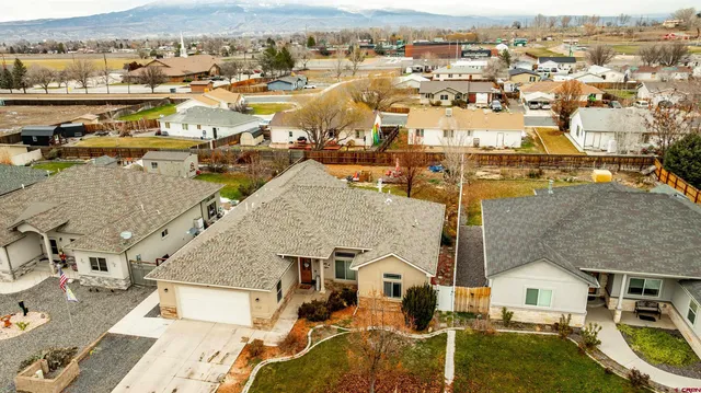 an aerial view of residential houses with outdoor space