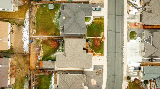an aerial view of residential houses with outdoor space