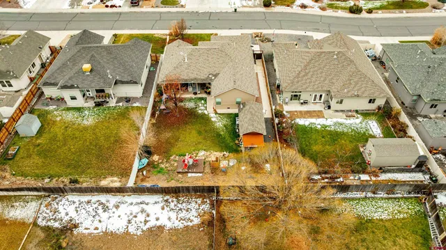 an aerial view of a building with parking