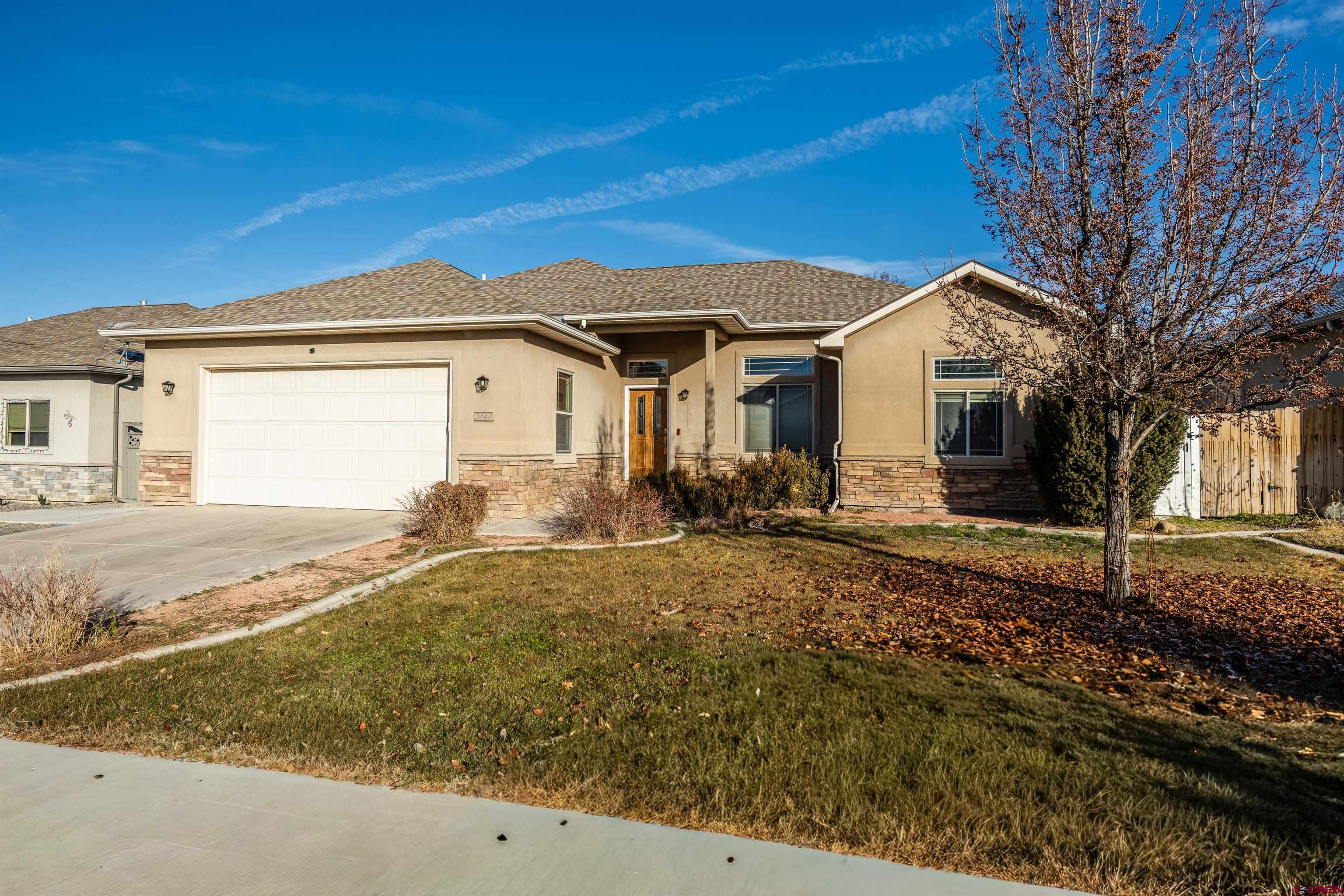 1443 Criterion Street Delta, CO 81416 - Photo 33 of 36 a front view of a house with a yard