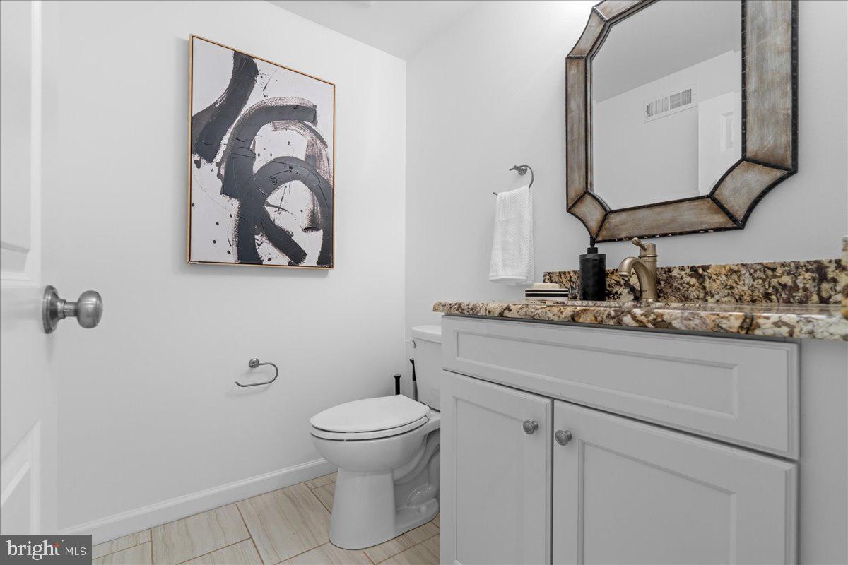 314 Fitzwater Street Philadelphia, PA 19147 - Photo 16 of 51 a bathroom with a toilet sink and mirror