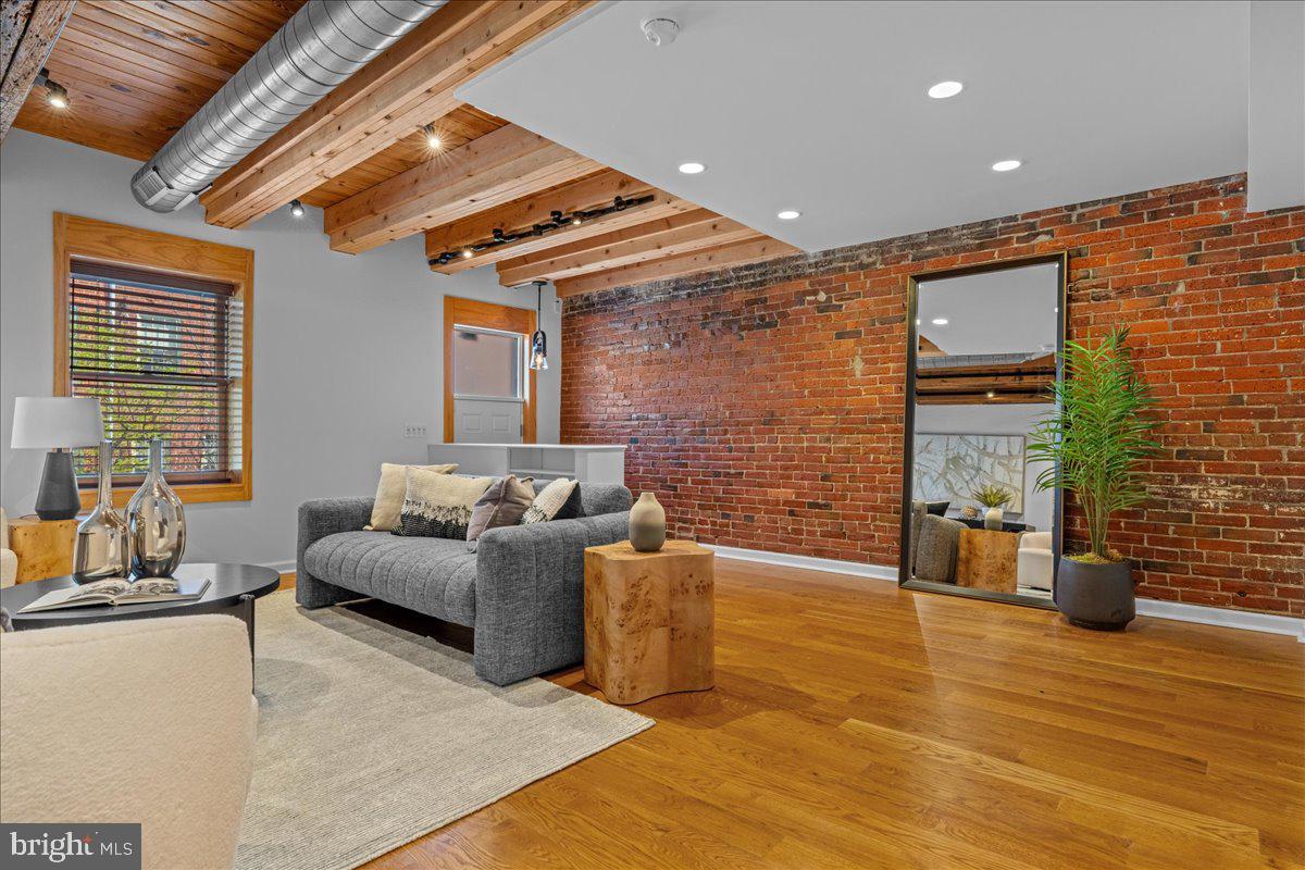 314 Fitzwater Street Philadelphia, PA 19147 - Photo 19 of 51 a living room with furniture floor to ceiling window and potted plant