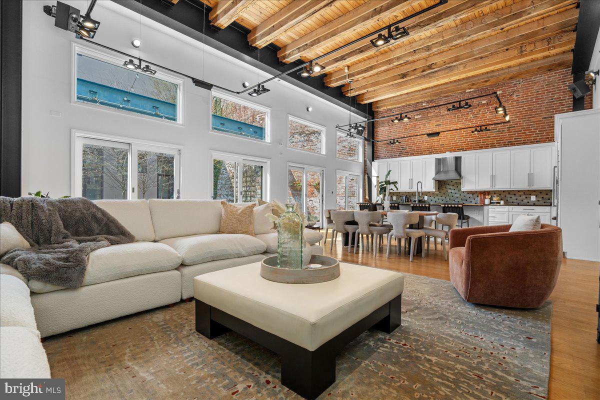 314 Fitzwater Street Philadelphia, PA 19147 - Photo 2 of 51 a living room with furniture and a chandelier