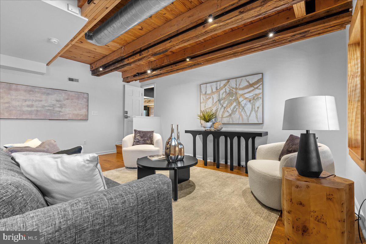 314 Fitzwater Street Philadelphia, PA 19147 - Photo 21 of 51 a living room with furniture and a lamp