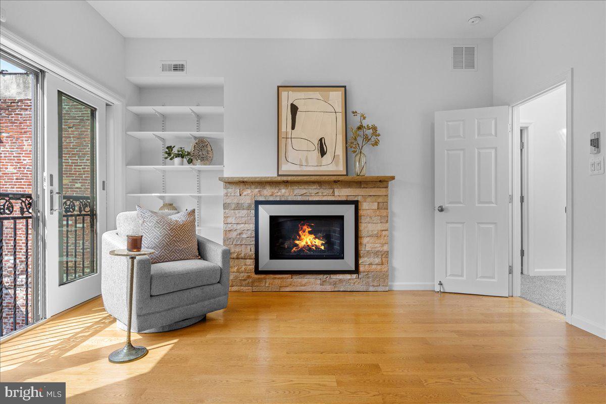 314 Fitzwater Street Philadelphia, PA 19147 - Photo 27 of 51 a living room with furniture and a fireplace
