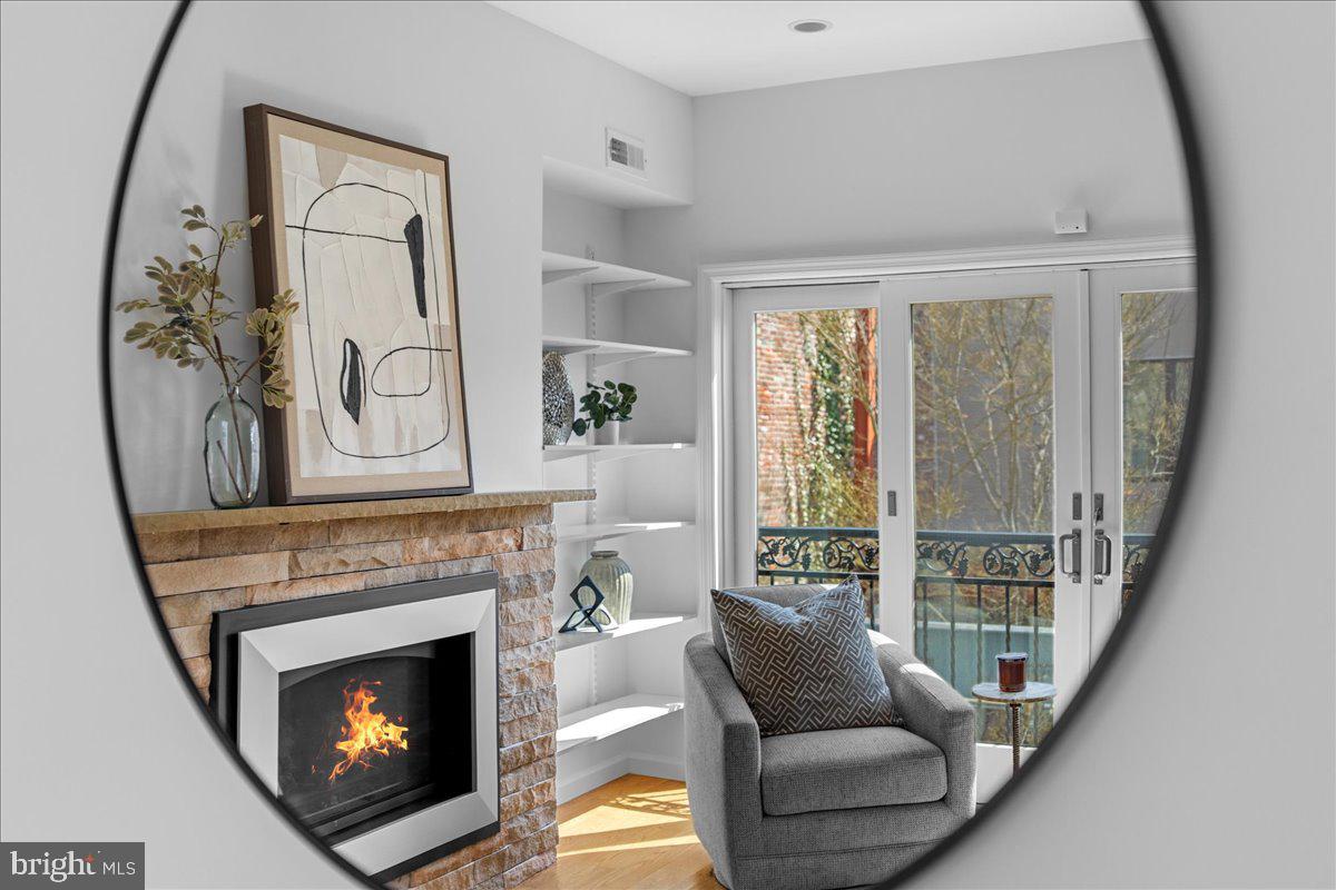314 Fitzwater Street Philadelphia, PA 19147 - Photo 29 of 51 a living room with furniture and a fireplace