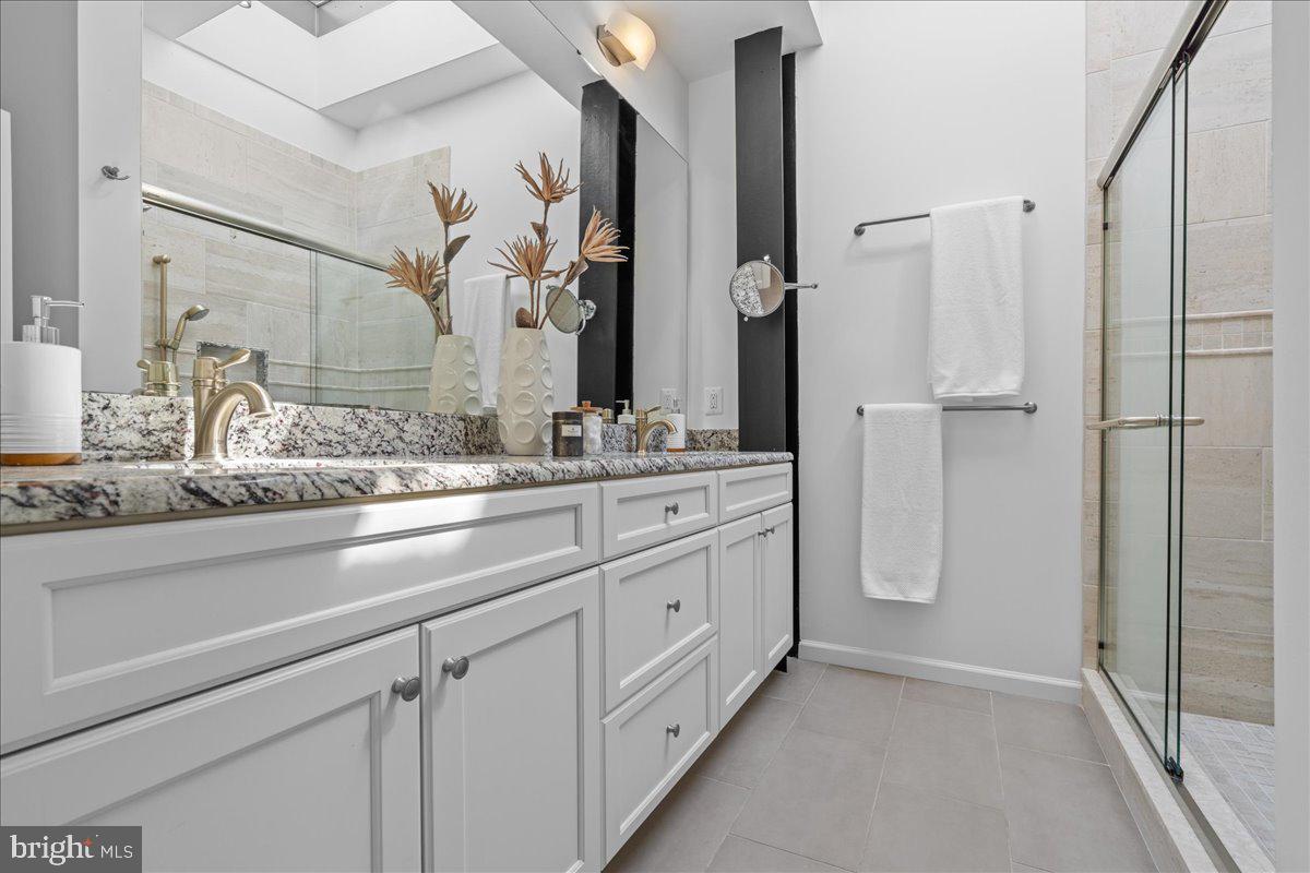 314 Fitzwater Street Philadelphia, PA 19147 - Photo 31 of 51 a bathroom with a double vanity sink and mirror