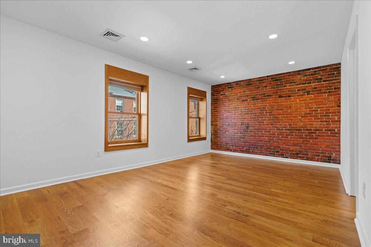 314 Fitzwater Street Philadelphia, PA 19147 - Photo 34 of 51 a view of an empty room with wooden floor and a window