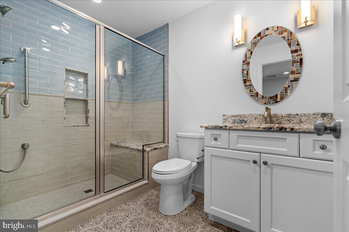 314 Fitzwater Street Philadelphia, PA 19147 - Photo 35 of 51 a bathroom with a toilet sink and a mirror