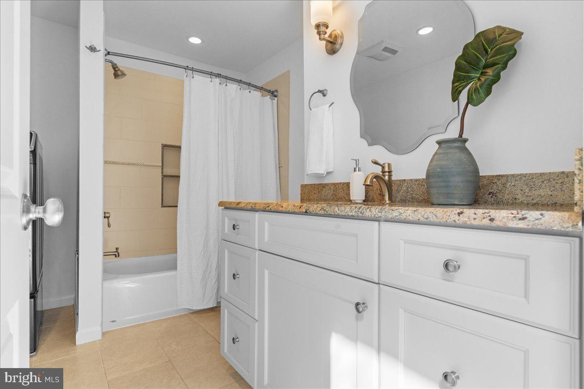 314 Fitzwater Street Philadelphia, PA 19147 - Photo 38 of 51 a bathroom with a granite countertop sink a mirror and shower