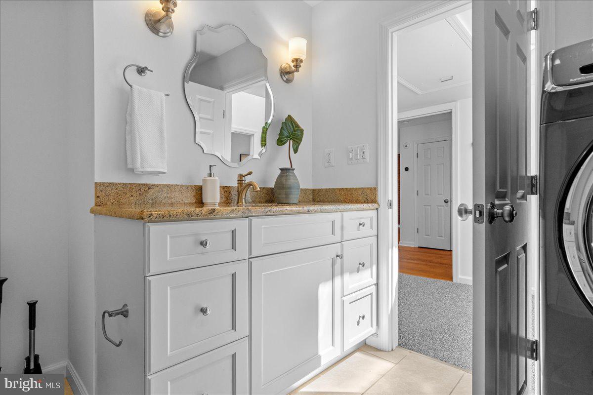 314 Fitzwater Street Philadelphia, PA 19147 - Photo 39 of 51 a bathroom with cabinets and mirror