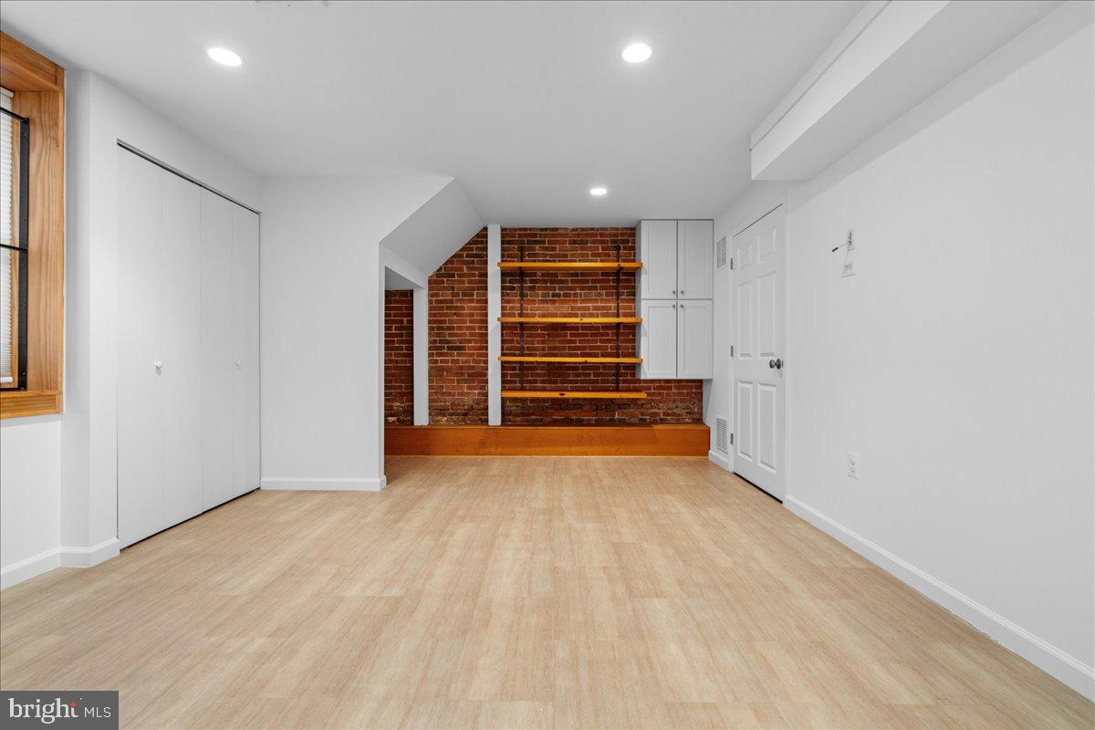 314 Fitzwater Street Philadelphia, PA 19147 - Photo 45 of 51 wooden floor in an empty room with a window