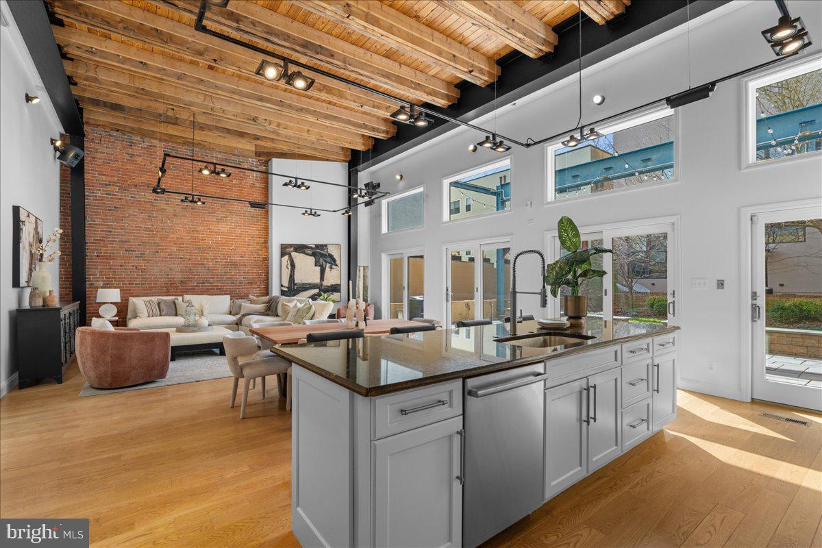 314 Fitzwater Street Philadelphia, PA 19147 - Photo 5 of 51 a kitchen with sink cabinets and living room view