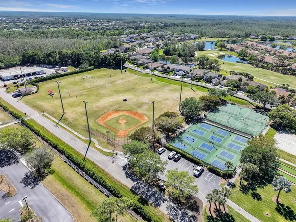 an aerial view of residential houses with outdoor space