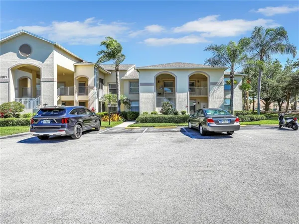 a building with cars parked in front of it
