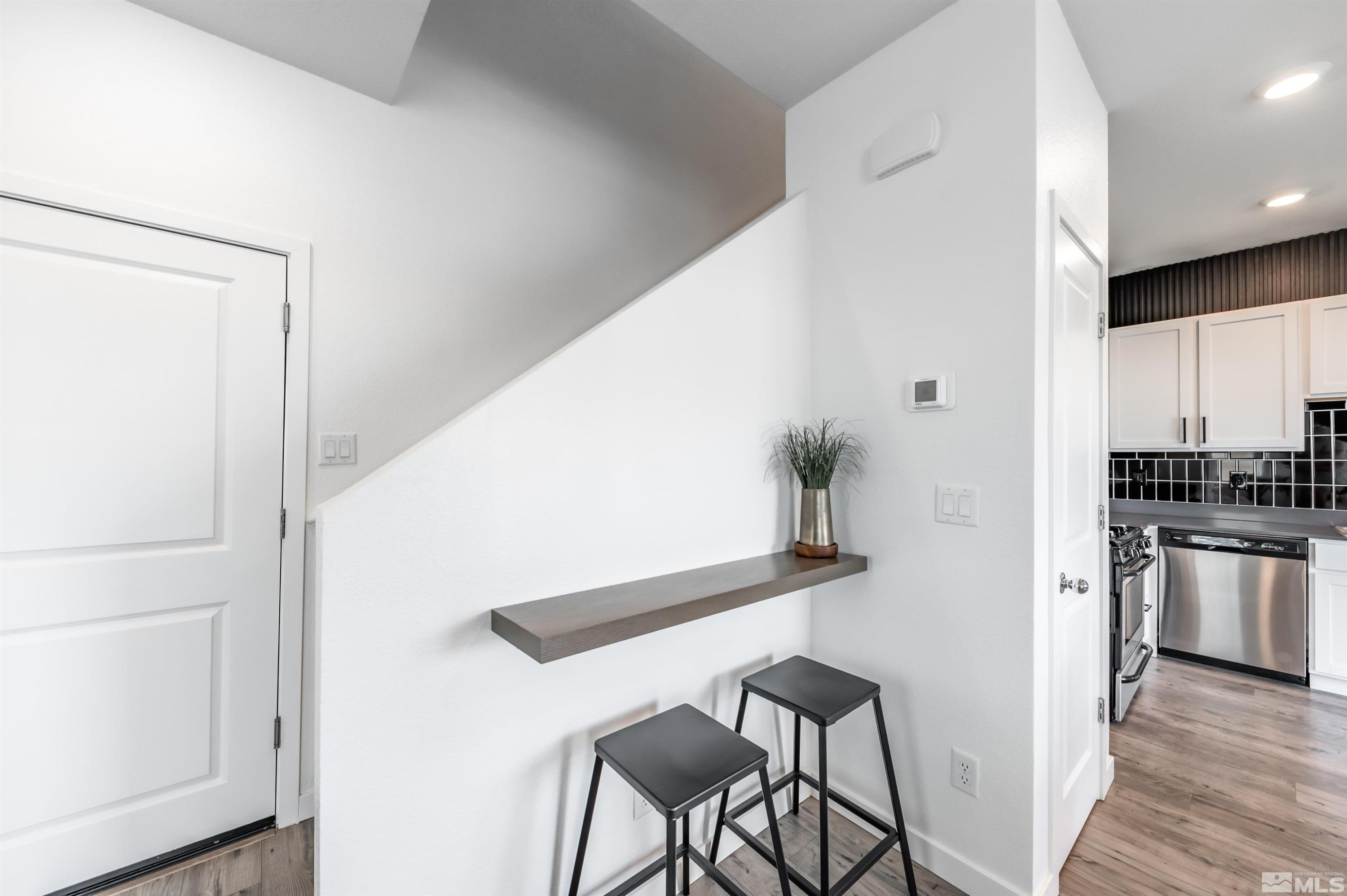 8855 Wolf Moon Drive Reno, NV 89506 - Photo 13 of 35 a view of kitchen with furniture and wooden floor