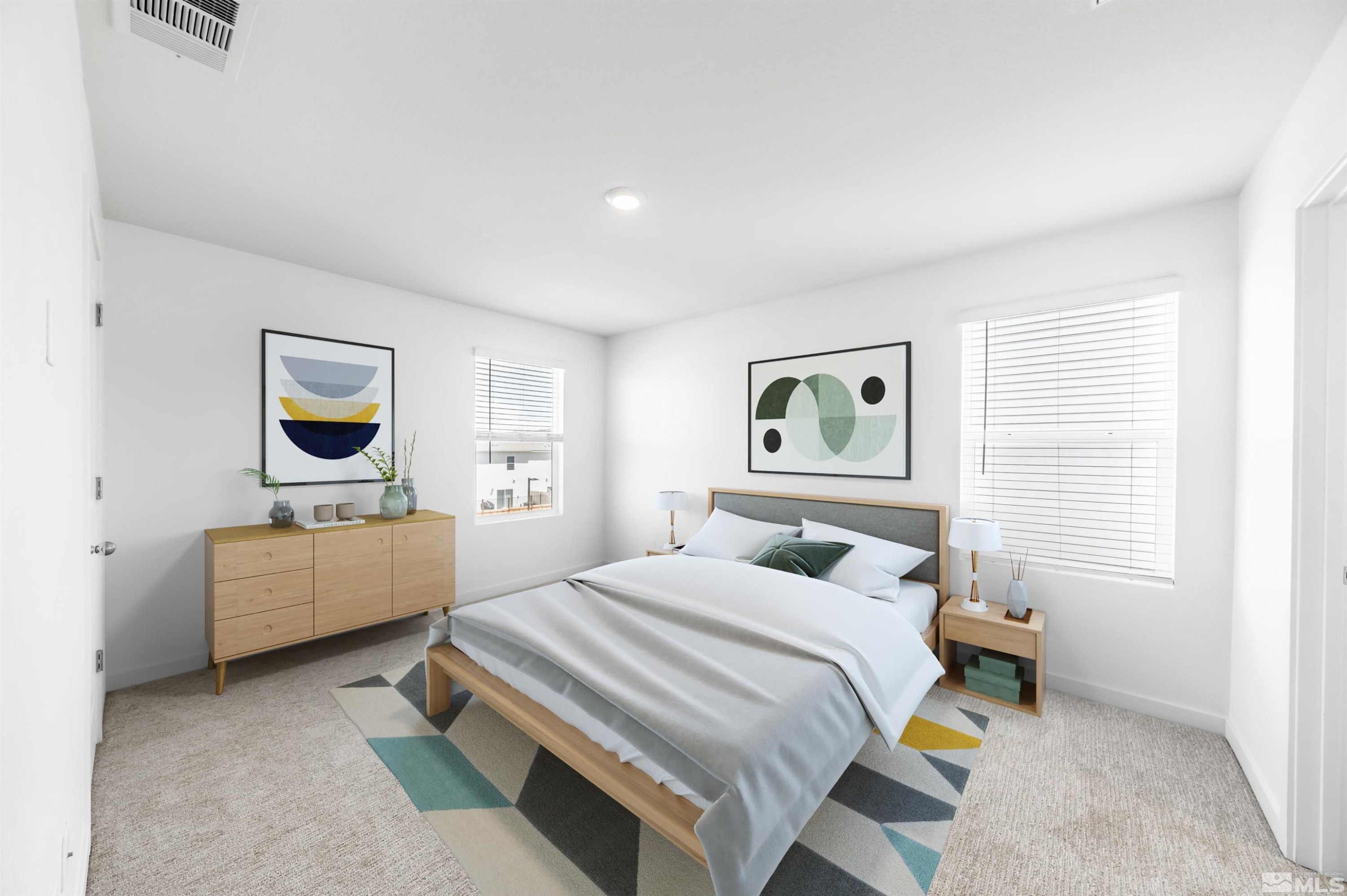 8855 Wolf Moon Drive Reno, NV 89506 - Photo 16 of 35 a bedroom with a bed and a couch