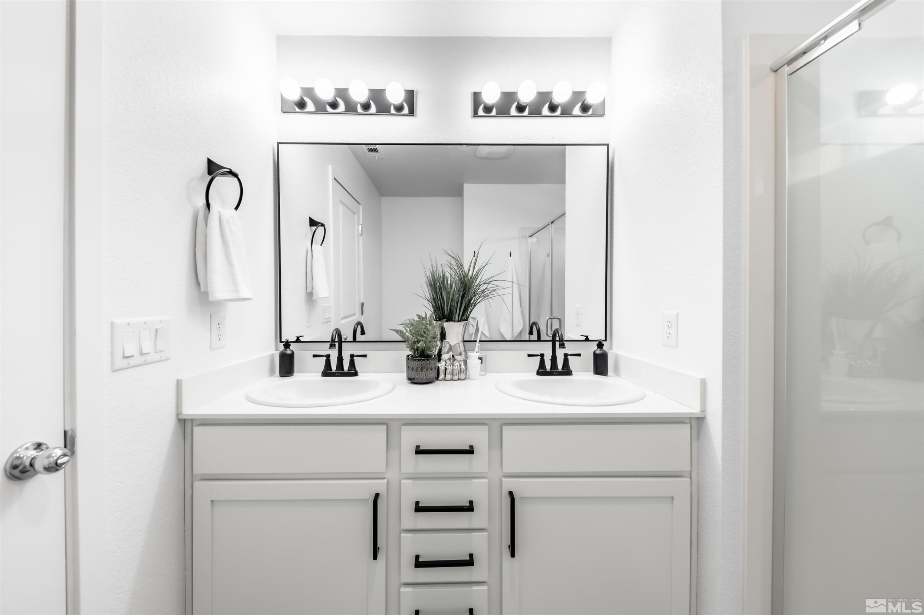 8855 Wolf Moon Drive Reno, NV 89506 - Photo 19 of 35 a bathroom with a sink and a mirror
