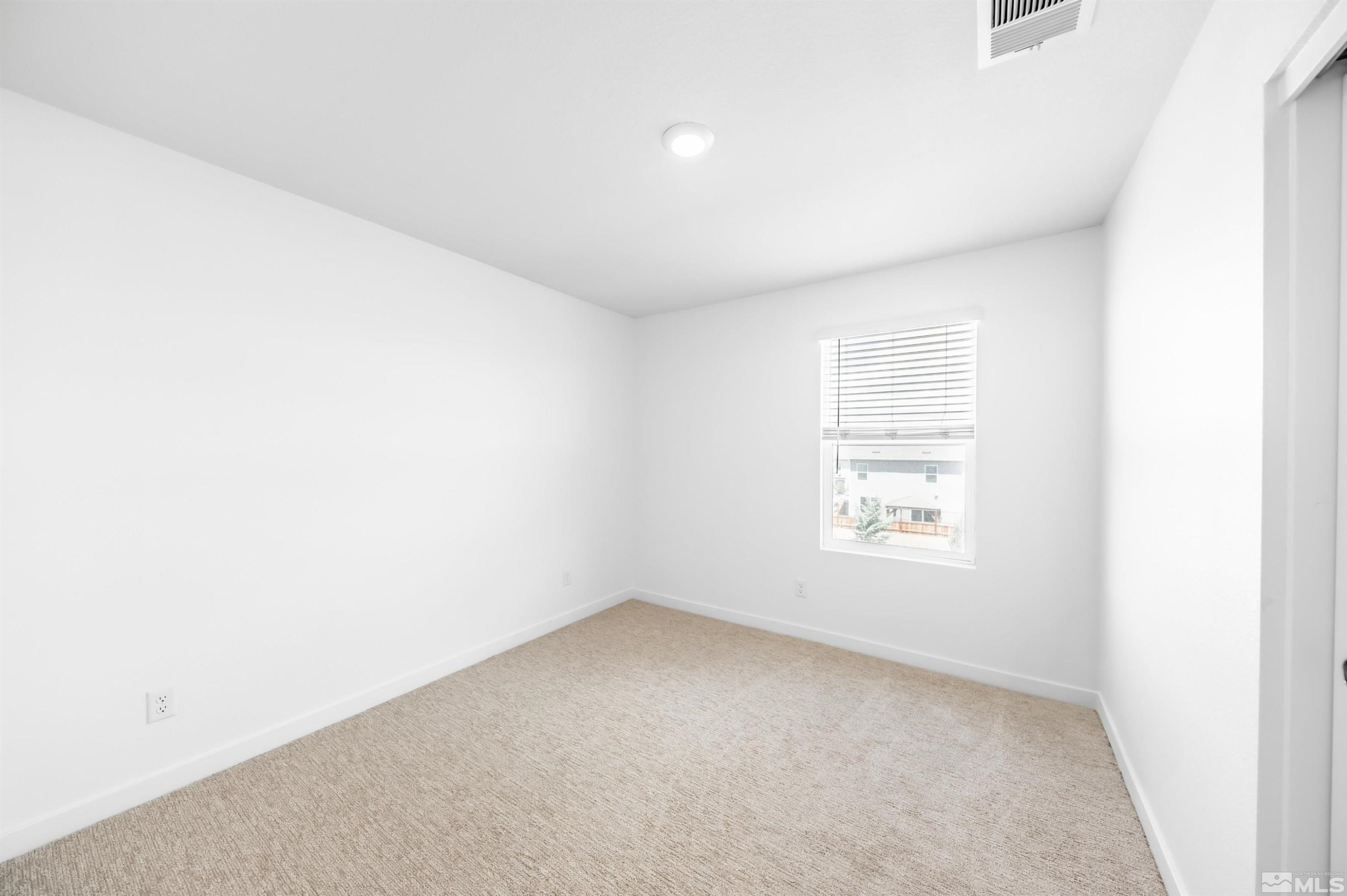 8855 Wolf Moon Drive Reno, NV 89506 - Photo 20 of 35 an empty room with a window