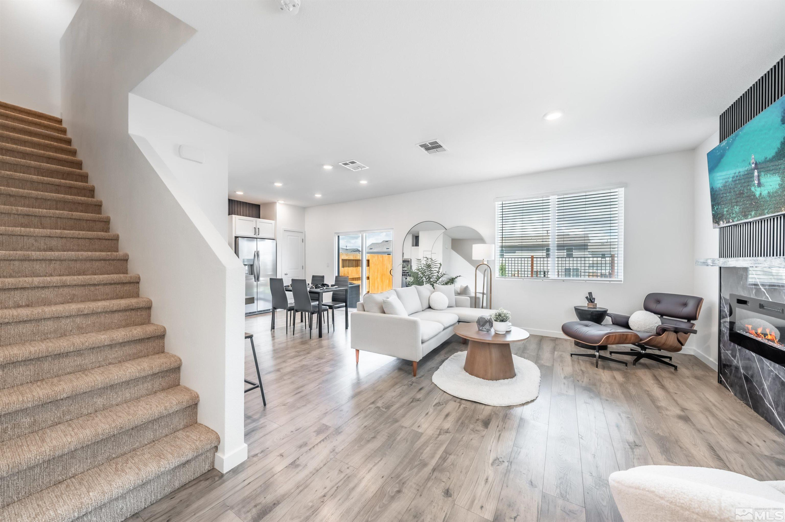 8855 Wolf Moon Drive Reno, NV 89506 - Photo 2 of 35 a living room with furniture and a table