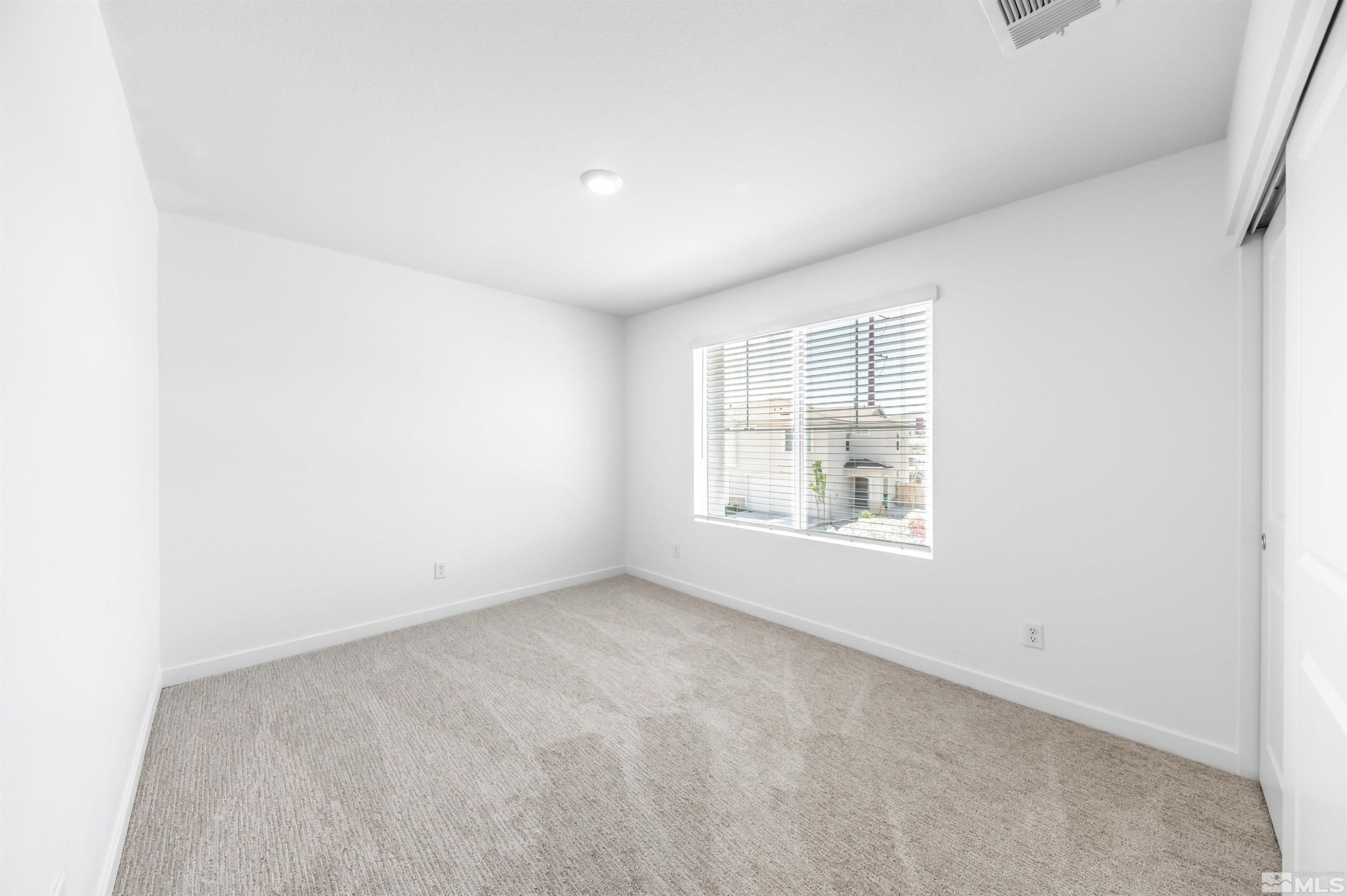 8855 Wolf Moon Drive Reno, NV 89506 - Photo 22 of 35 an empty room with a window