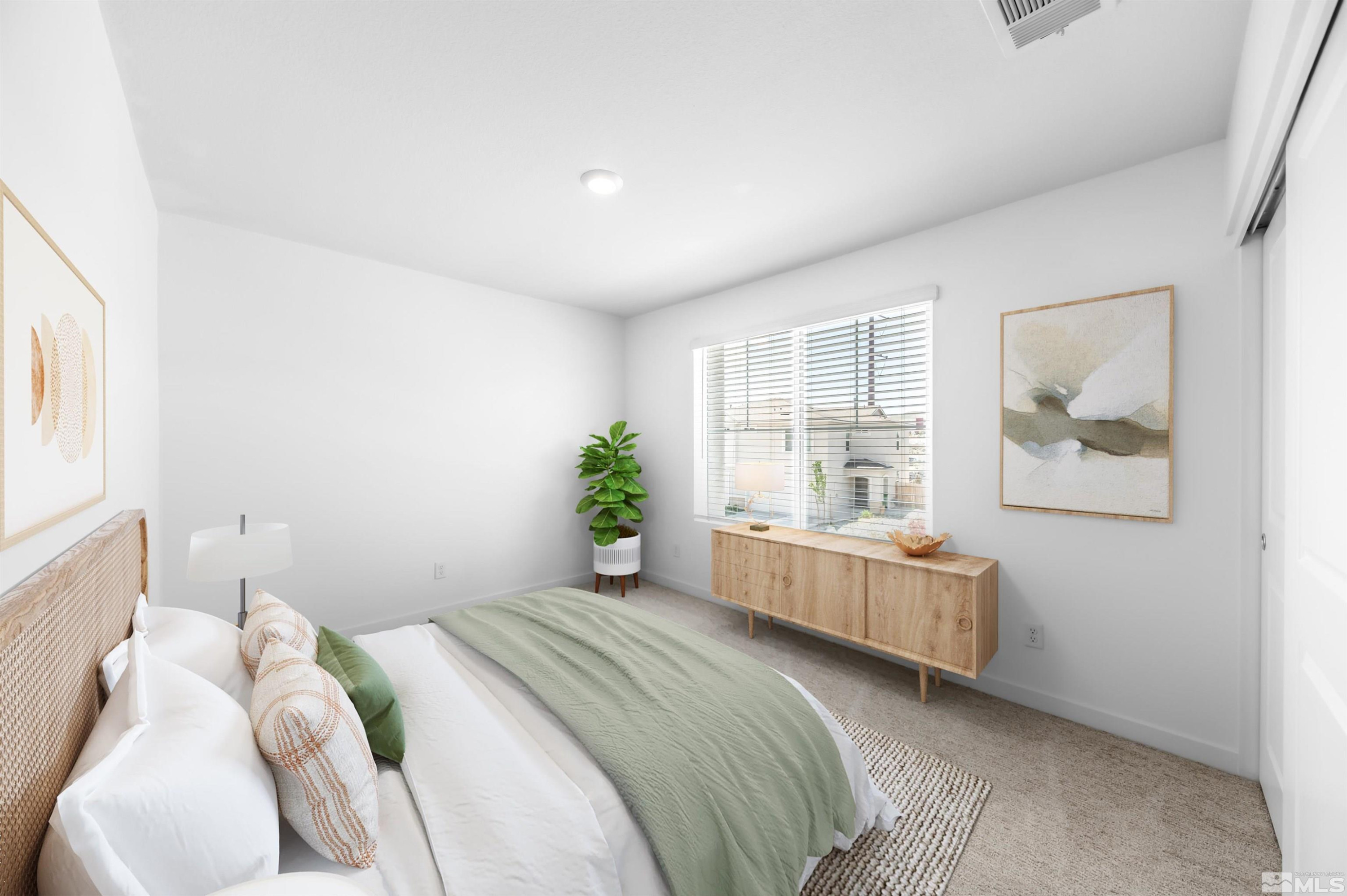 8855 Wolf Moon Drive Reno, NV 89506 - Photo 23 of 35 a bedroom with a bed and a large window