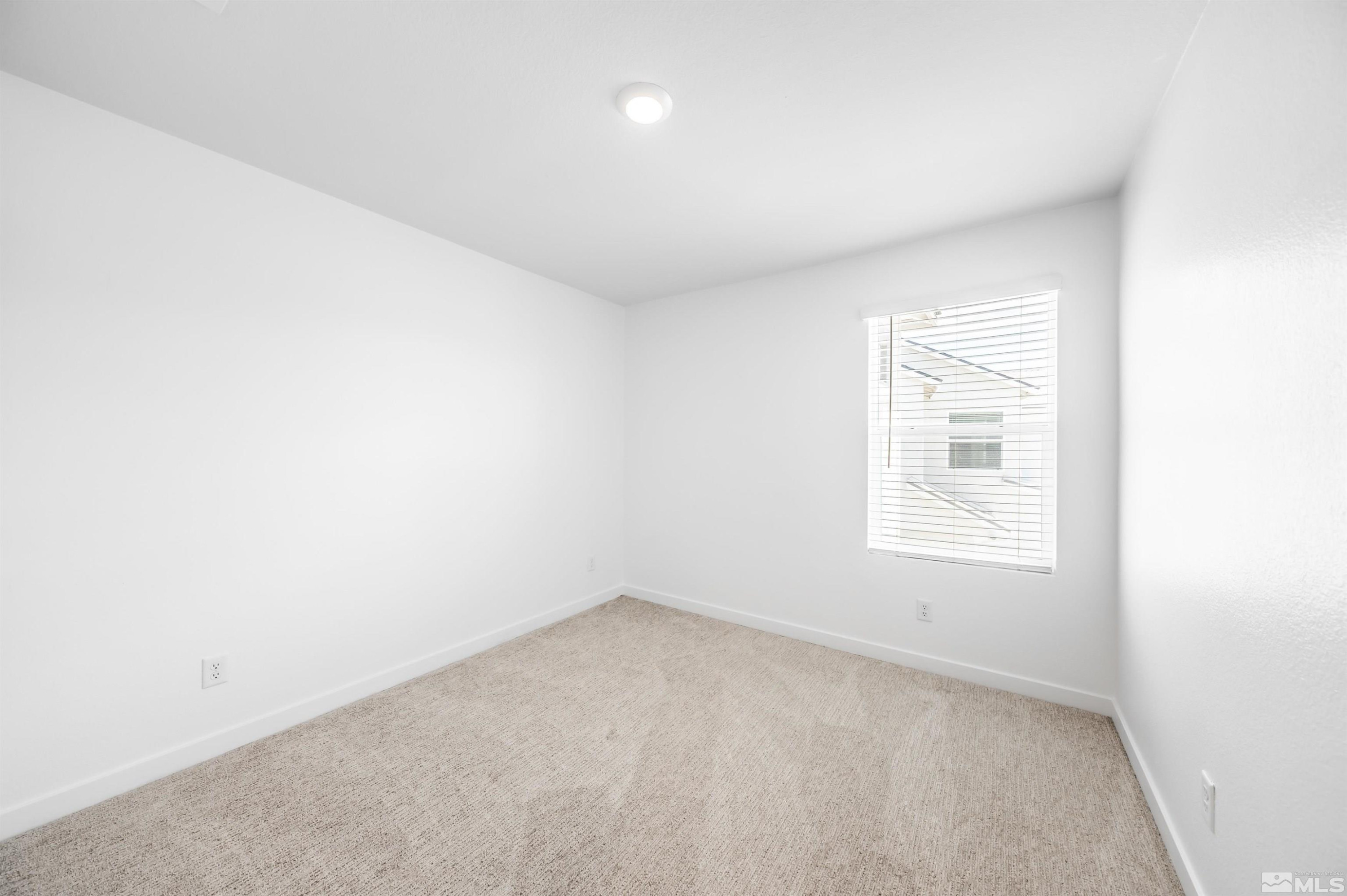 8855 Wolf Moon Drive Reno, NV 89506 - Photo 24 of 35 an empty room with a window