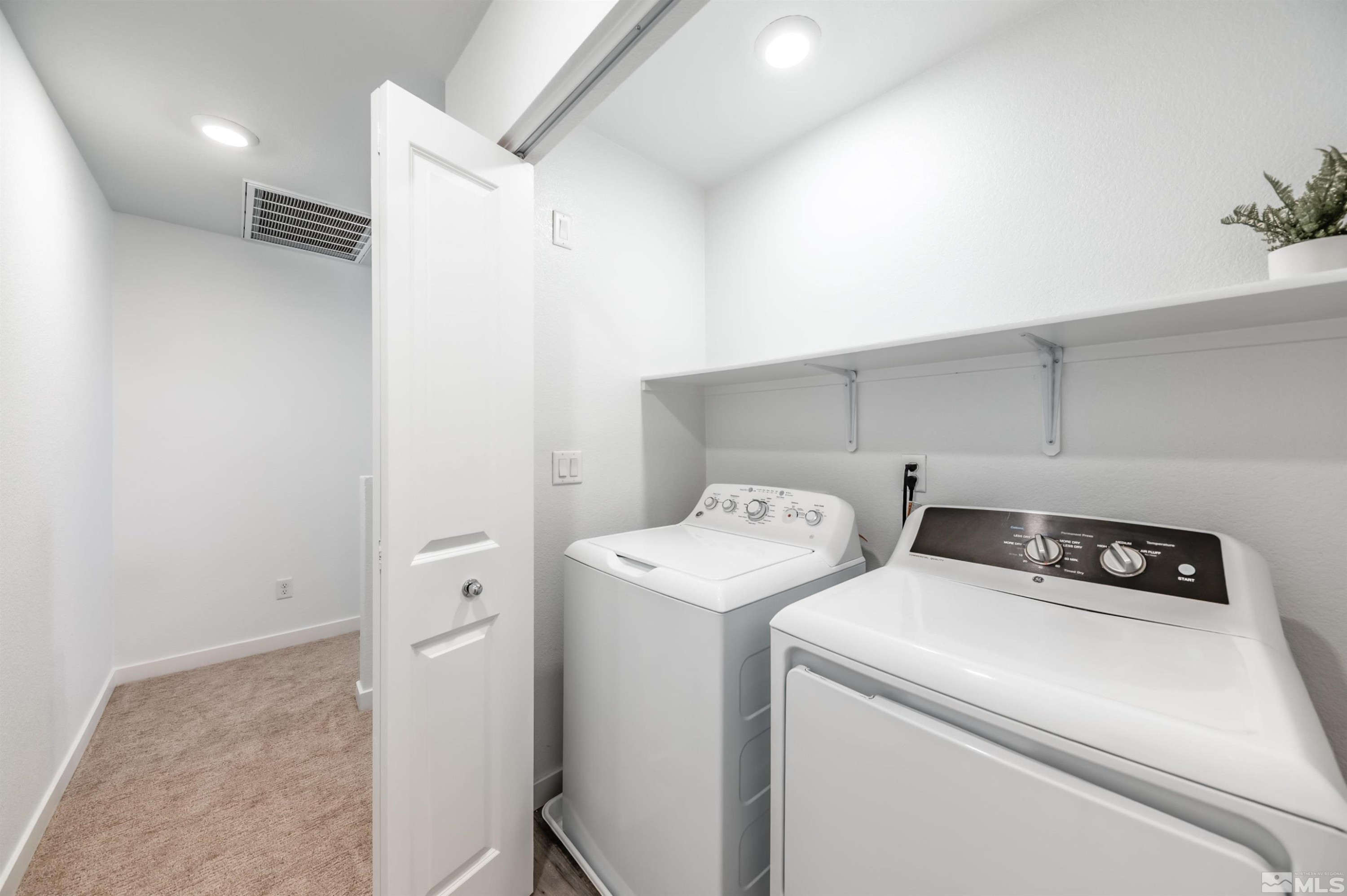 8855 Wolf Moon Drive Reno, NV 89506 - Photo 27 of 35 a view of storage and utility room with washer and dryer