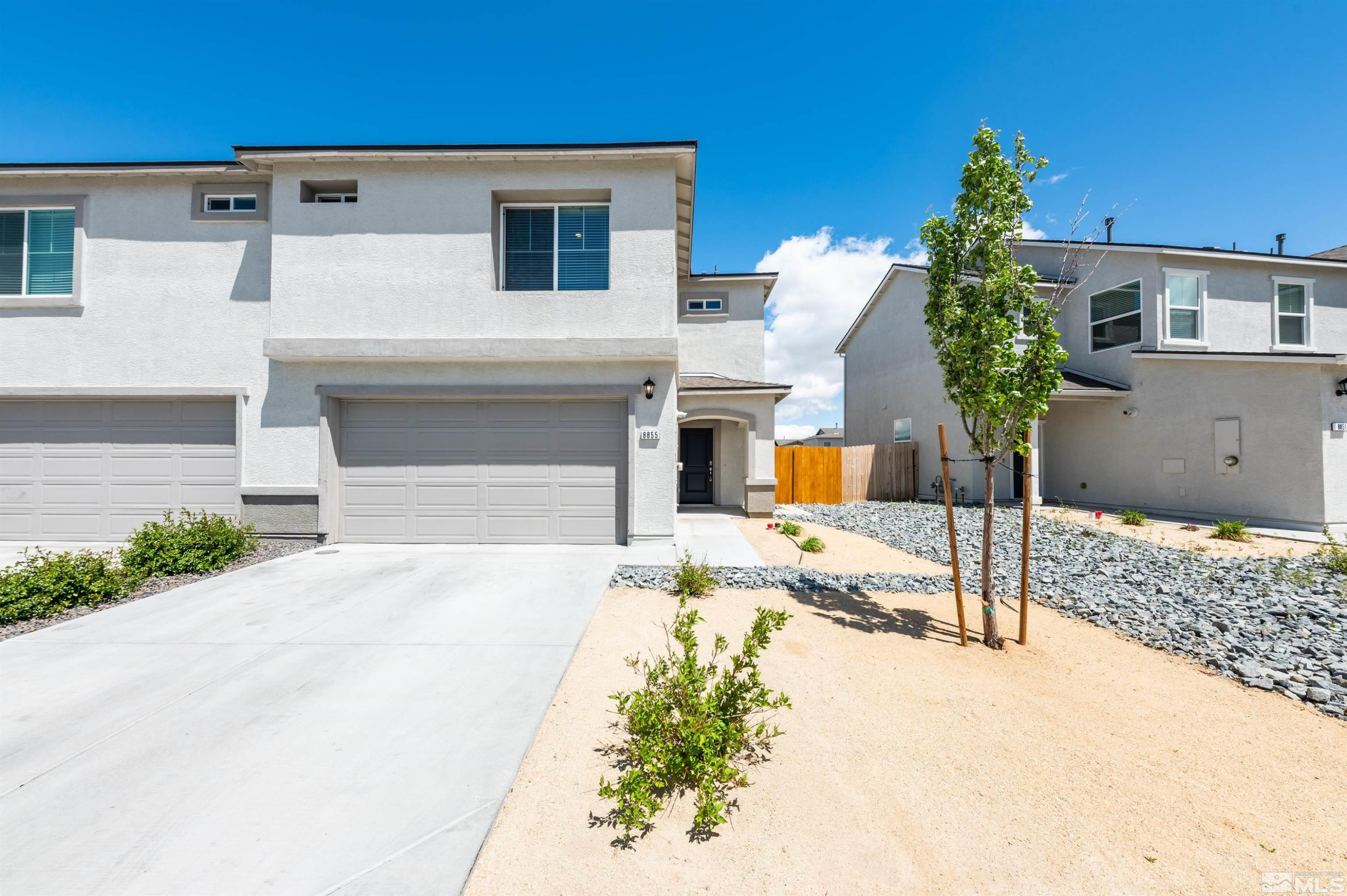 8855 Wolf Moon Drive Reno, NV 89506 - Photo 34 of 35 a front view of a house with a yard