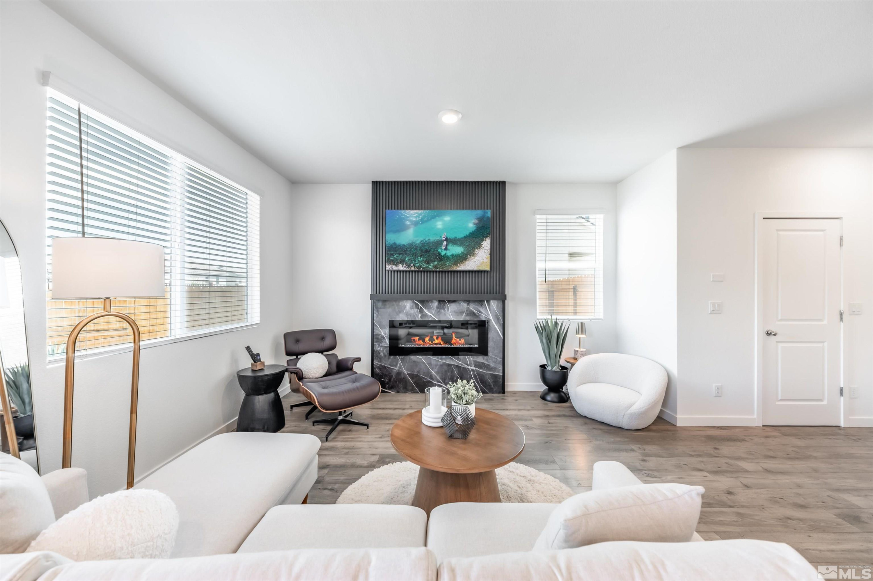 8855 Wolf Moon Drive Reno, NV 89506 - Photo 6 of 35 a living room with furniture and a large window