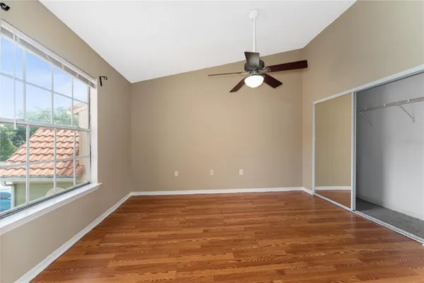 a view of room with window and ceiling fan