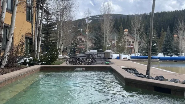 a view of a swimming pool with a patio