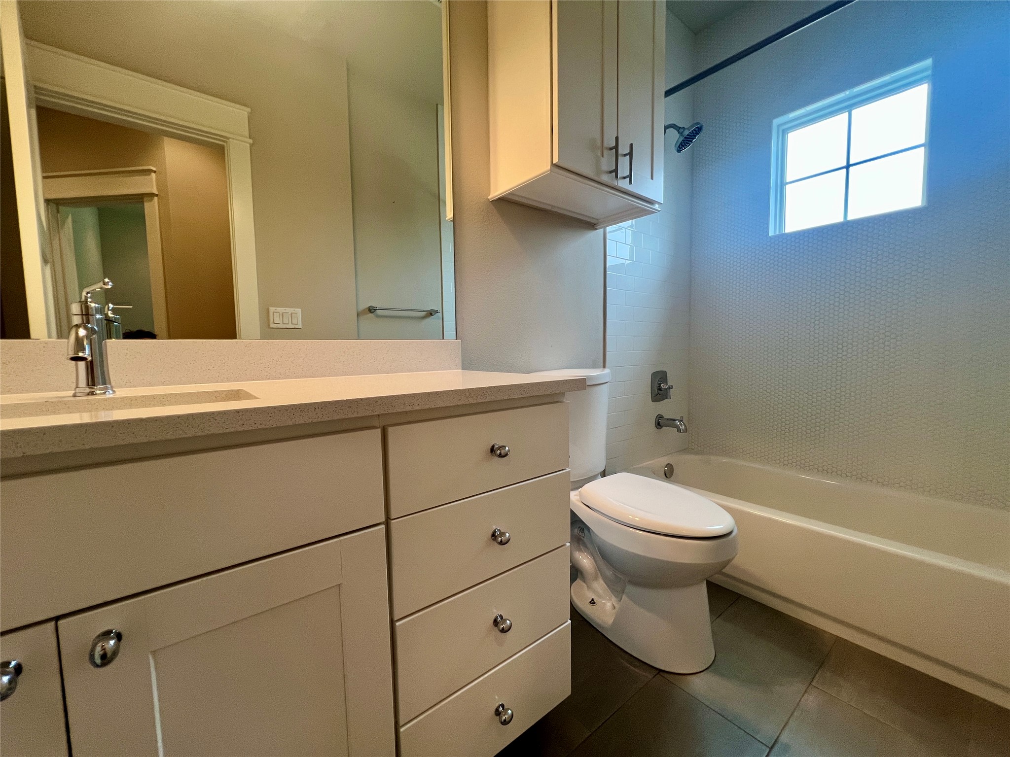 6515 Davis Lane, Unit 10 Austin, TX 78749 - Photo 19 of 22 Modern full bathroom with spacious vanity and tile shower-tub combination.