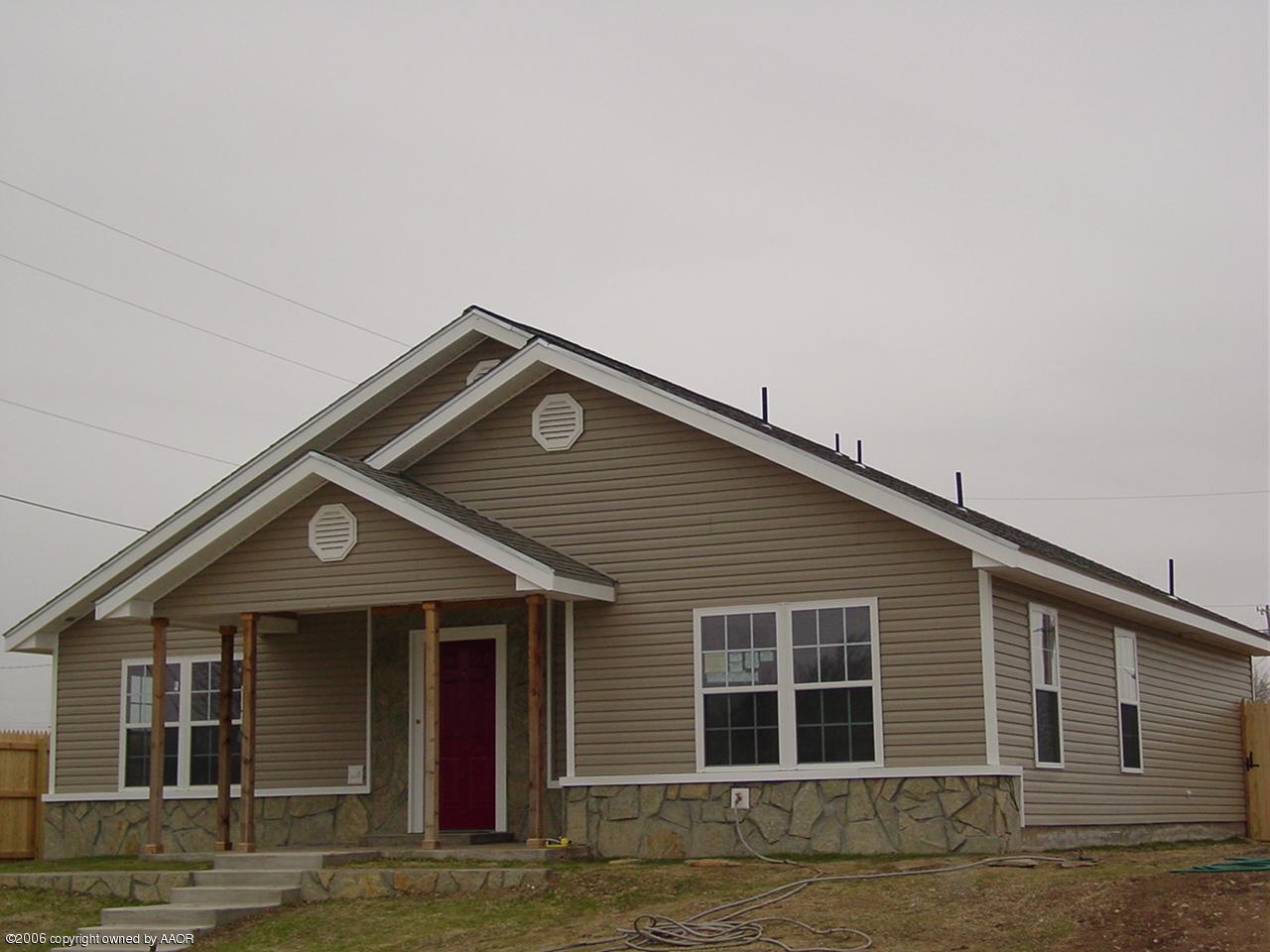 4414 South Austin Street Amarillo, TX 79110 - Photo 1 of 7 a front view of a house with garage