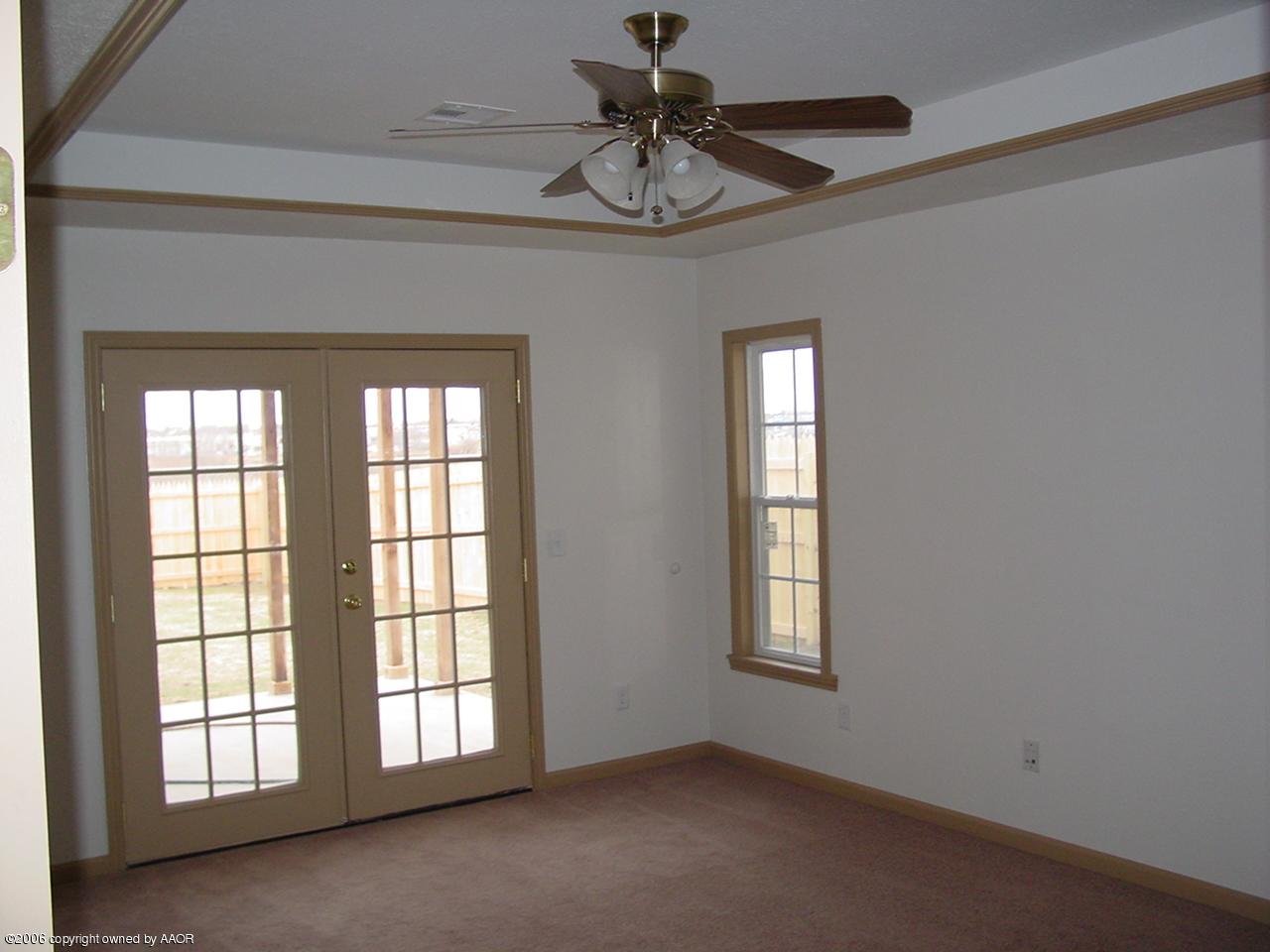 4414 South Austin Street Amarillo, TX 79110 - Photo 4 of 7 a view of an empty room with a window