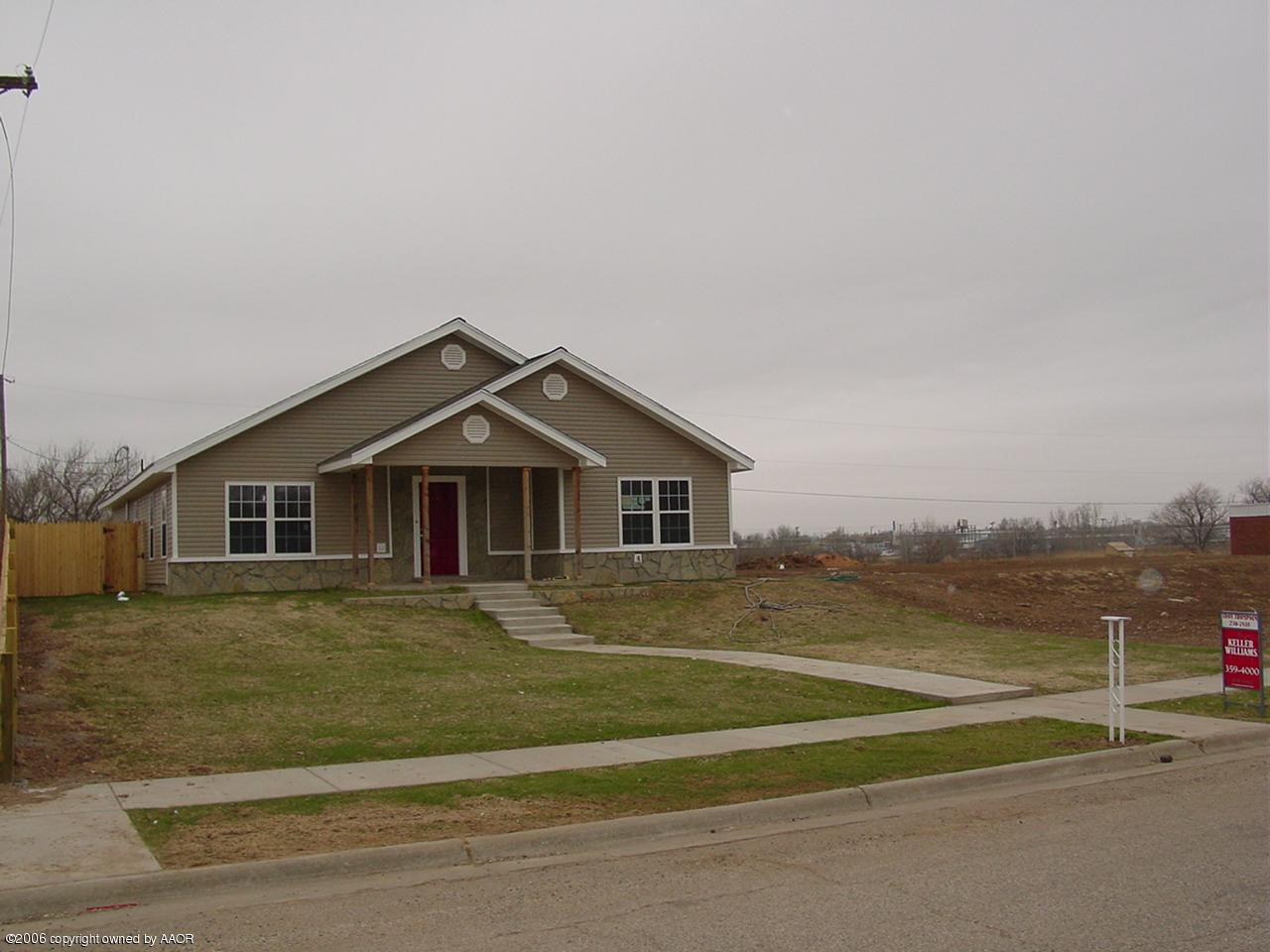 4414 South Austin Street Amarillo, TX 79110 - Photo 7 of 7 a front view of a house with a yard and trees