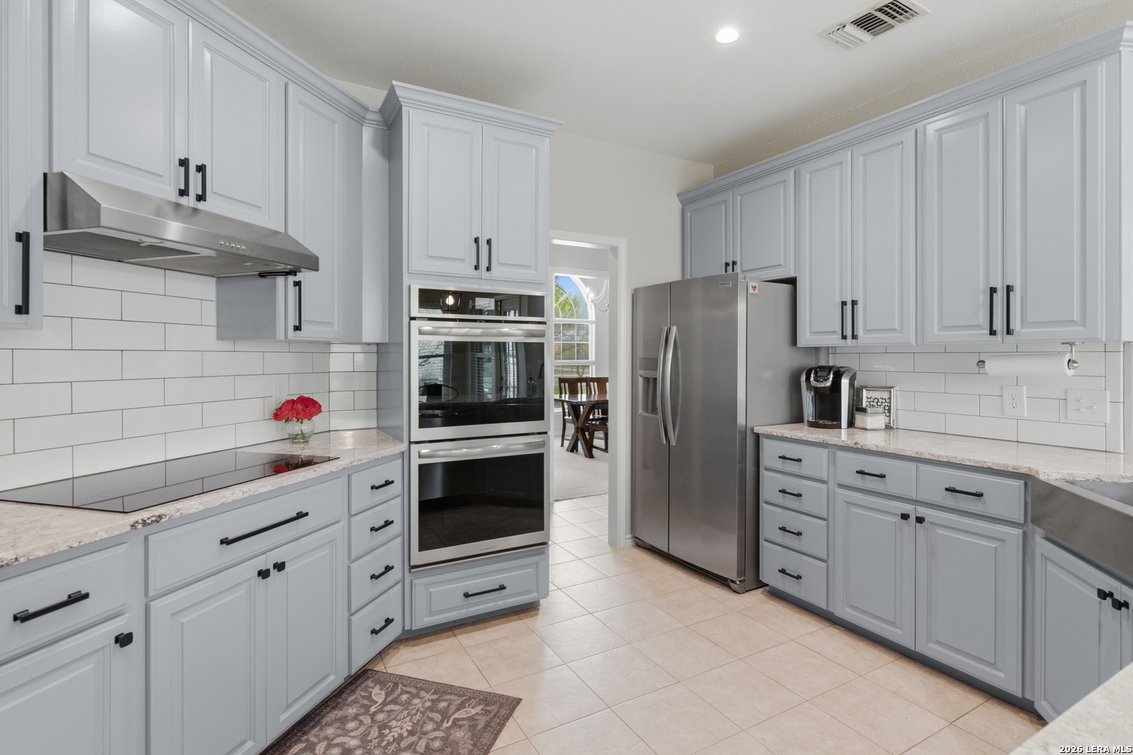 105 Old Campbell Road Seguin, TX 78155 - Photo 11 of 49 a kitchen with appliances a sink and cabinets