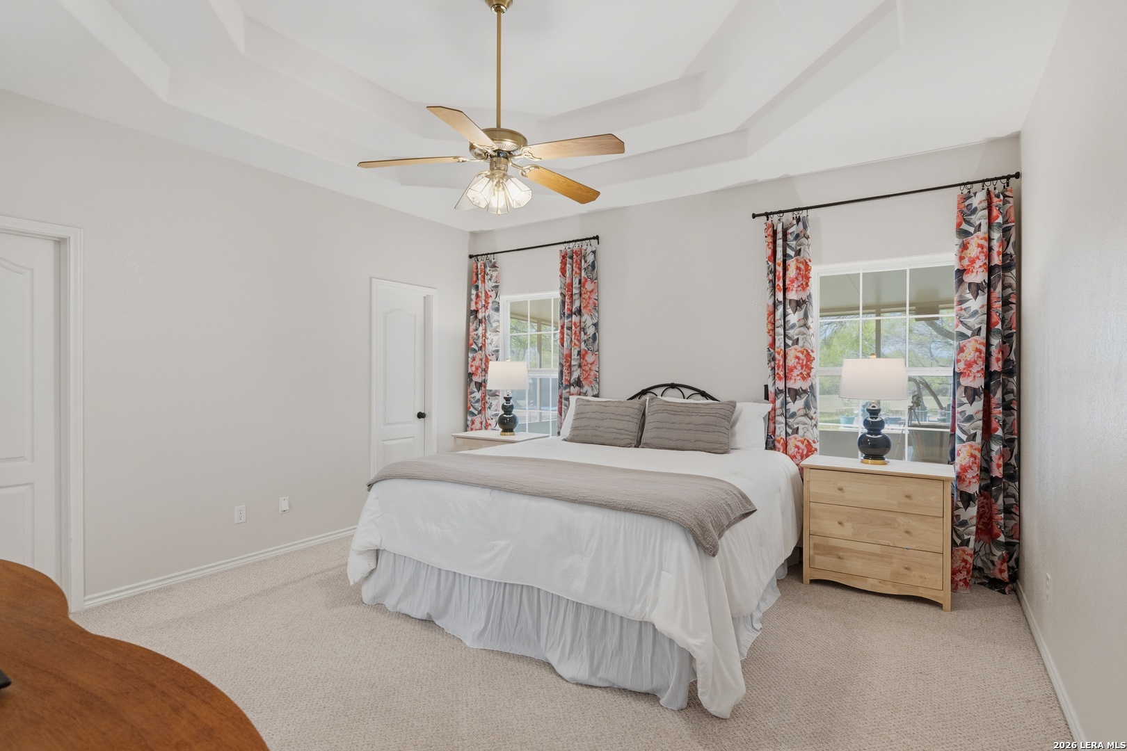 105 Old Campbell Road Seguin, TX 78155 - Photo 19 of 49 a bedroom with bed and a chandelier