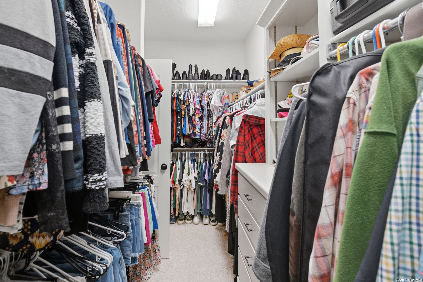105 Old Campbell Road Seguin, TX 78155 - Photo 24 of 49 a view of walk in closet with clothes