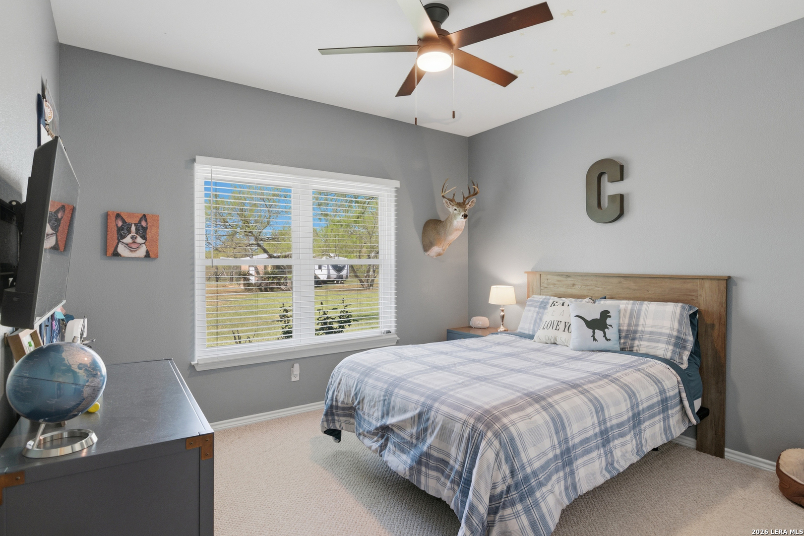 105 Old Campbell Road Seguin, TX 78155 - Photo 25 of 49 a bedroom with a large bed and a window