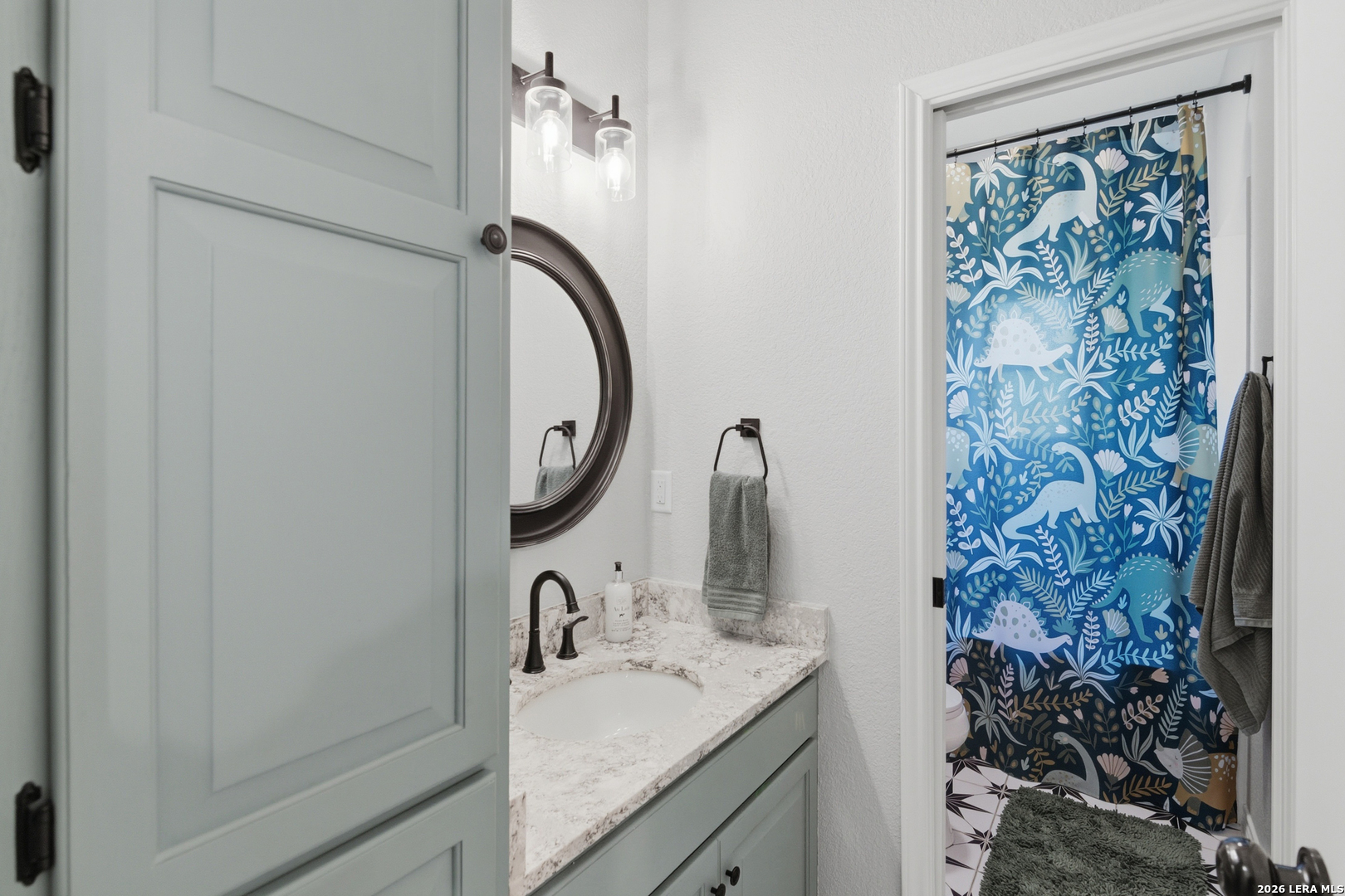 105 Old Campbell Road Seguin, TX 78155 - Photo 27 of 49 a bathroom with a granite countertop sink toilet and shower