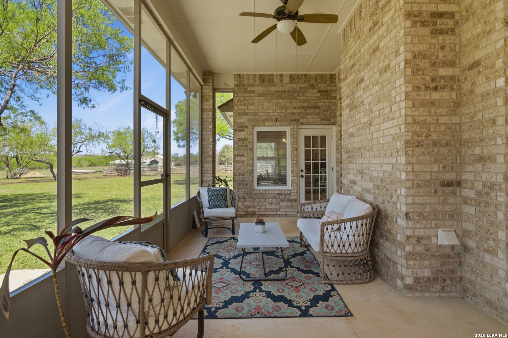 105 Old Campbell Road Seguin, TX 78155 - Photo 30 of 49 a living room with furniture and a floor to ceiling window
