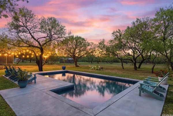 a view of swimming pool with a patio