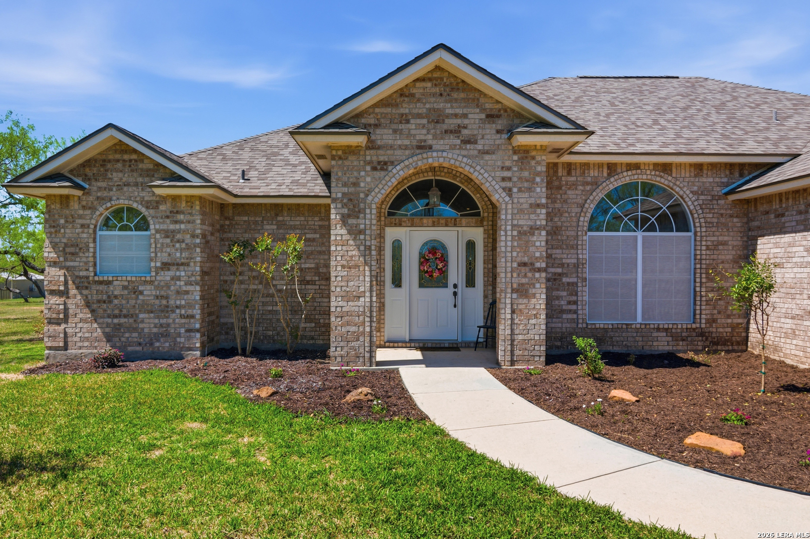 105 Old Campbell Road Seguin, TX 78155 - Photo 4 of 49 a front view of a house with a garden