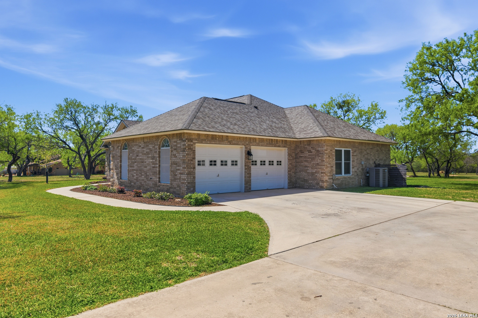 105 Old Campbell Road Seguin, TX 78155 - Photo 43 of 49 a front view of a house with a garden and yard