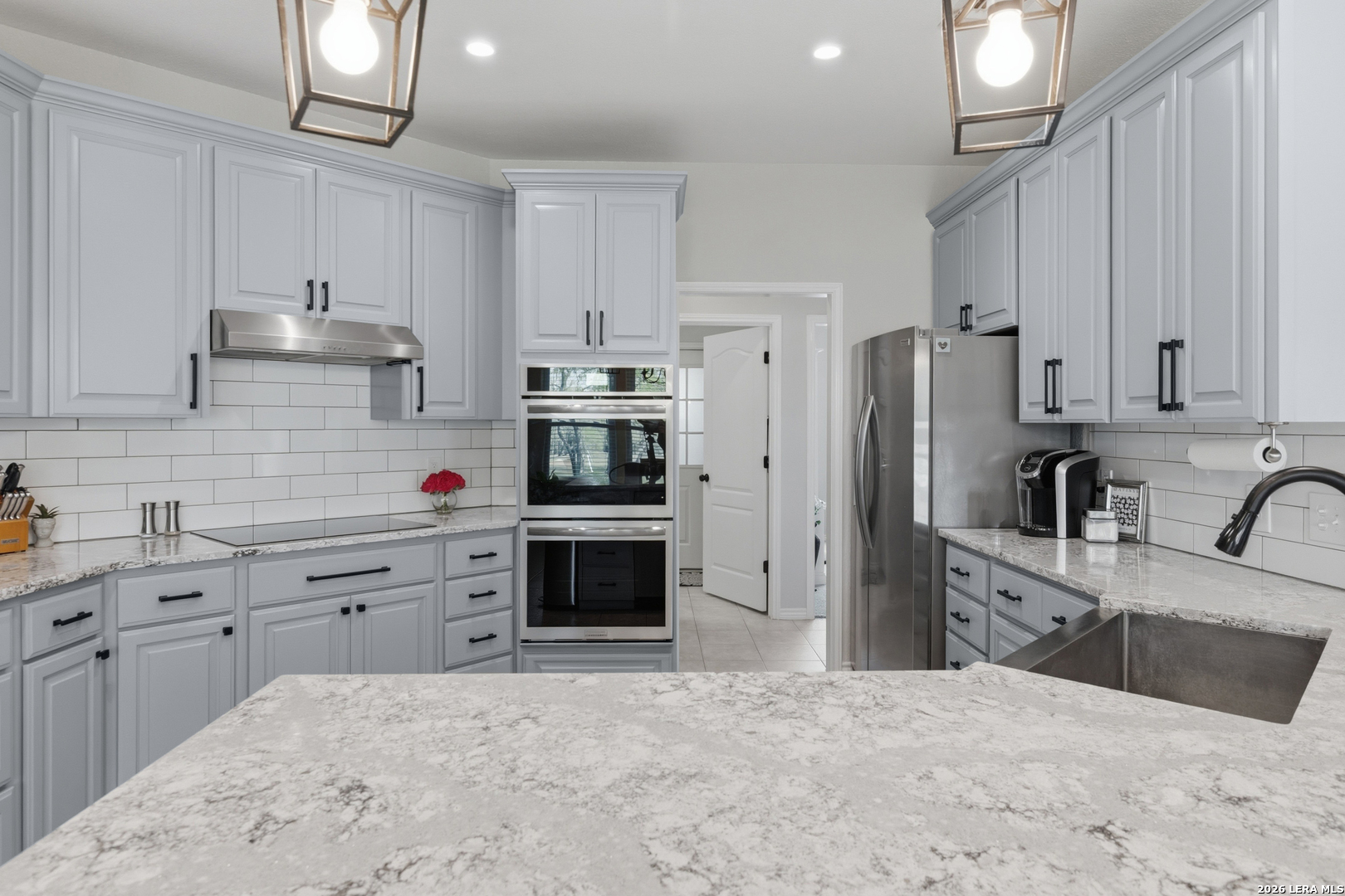 105 Old Campbell Road Seguin, TX 78155 - Photo 7 of 49 a kitchen with stainless steel appliances a refrigerator sink and cabinets