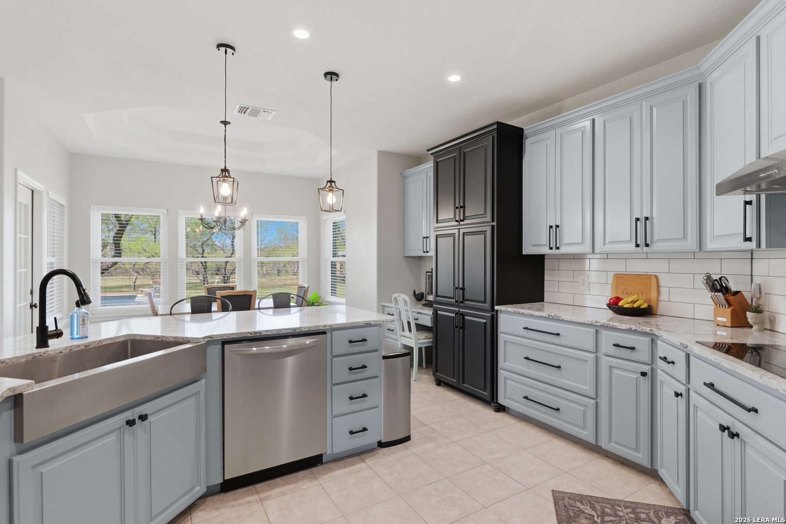 105 Old Campbell Road Seguin, TX 78155 - Photo 8 of 49 a kitchen with kitchen island white cabinets and stainless steel appliances