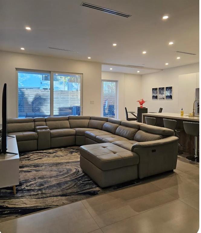 2275 Southeast 7th Street Pompano Beach, FL 33062 - Photo 2 of 14 a living room with furniture wooden floor and a flat screen tv