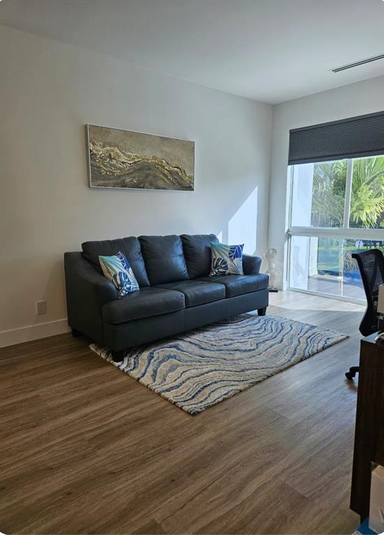 2275 Southeast 7th Street Pompano Beach, FL 33062 - Photo 7 of 14 a living room with furniture window and wooden floor