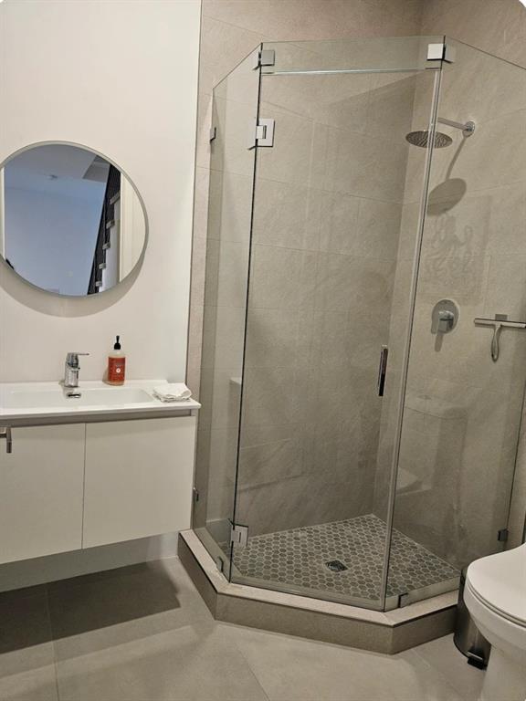 2275 Southeast 7th Street Pompano Beach, FL 33062 - Photo 8 of 14 a bathroom with a sink mirror and a shower